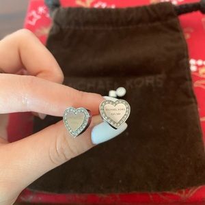Michael Kors silver heart earrings.